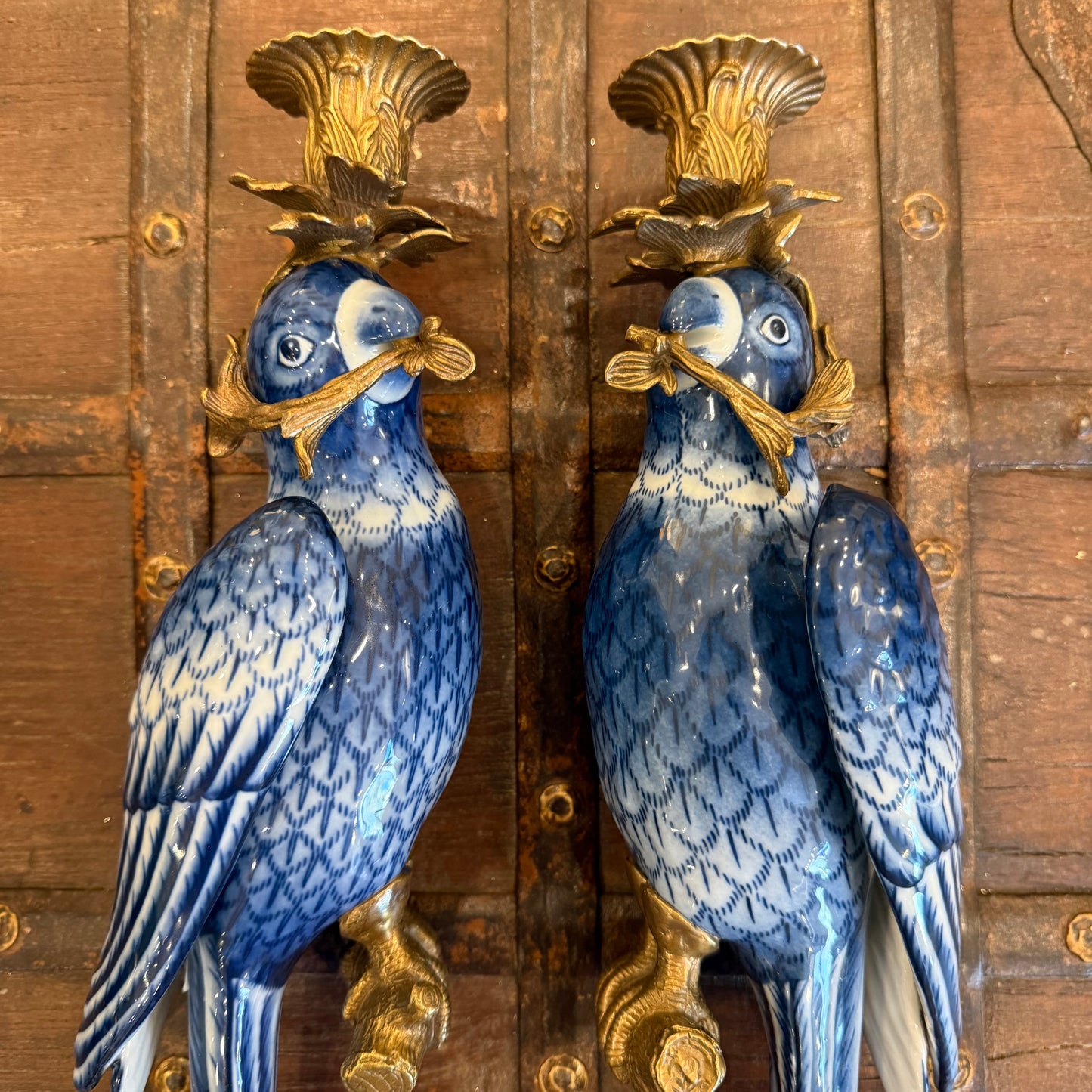 A Pair Of Ceramic and Bronze Parrot Wall Sconces