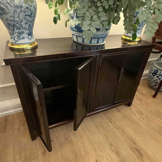 A striking Oriental Sideboard In Rich Black Lacquer