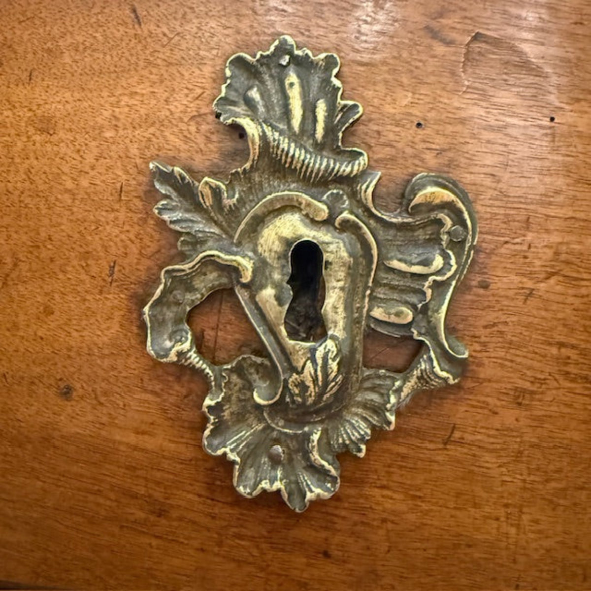 Early Provincial French Commode With Elaborate Brass Escutcheons