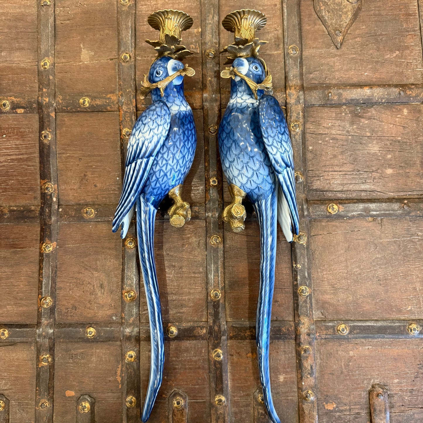 A Pair Of Ceramic and Bronze Parrot Wall Sconces