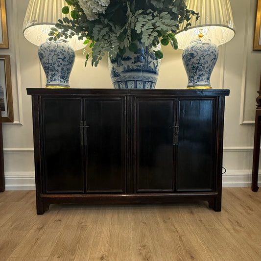 A striking Oriental Sideboard In Rich Black Lacquer