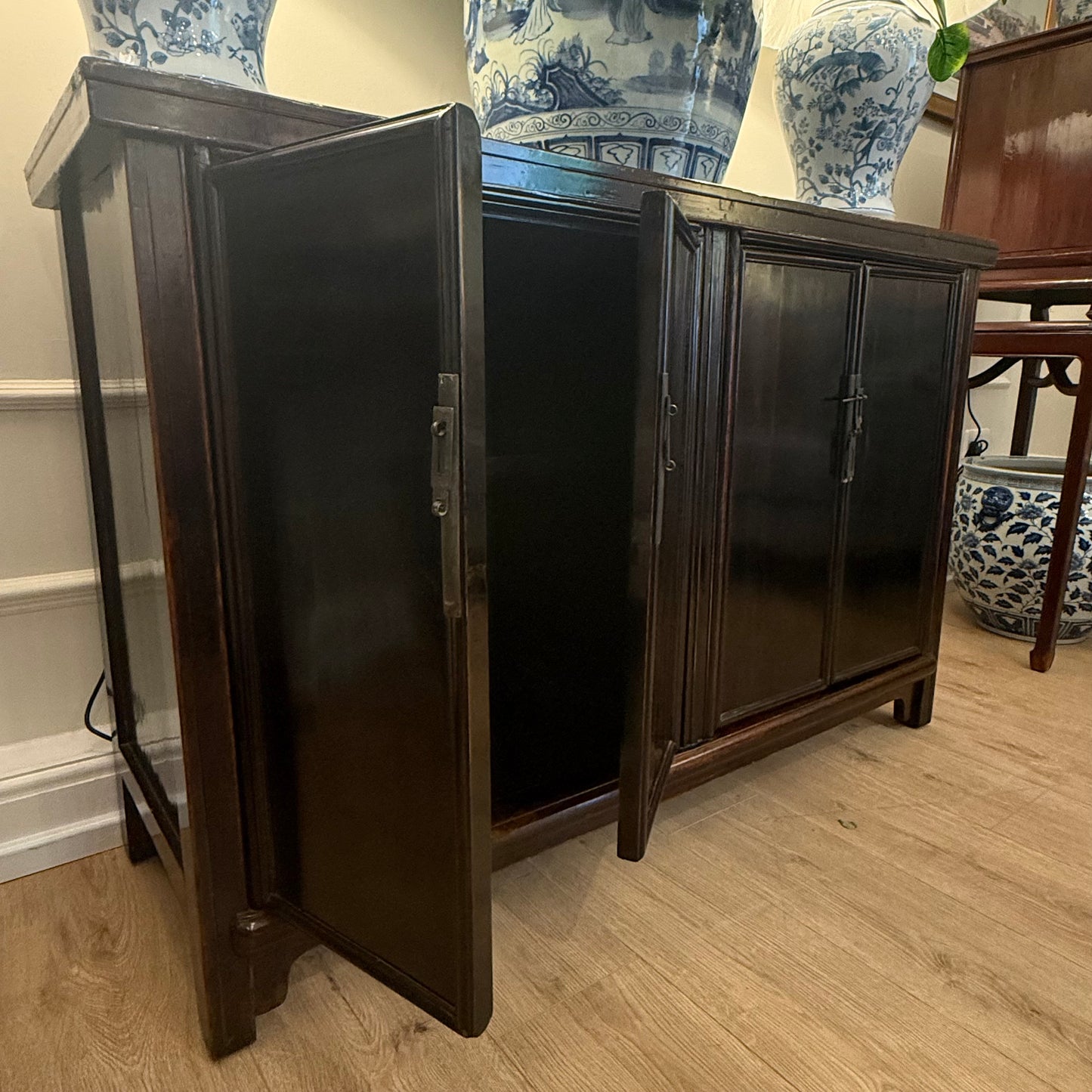 A striking Oriental Sideboard In Rich Black Lacquer