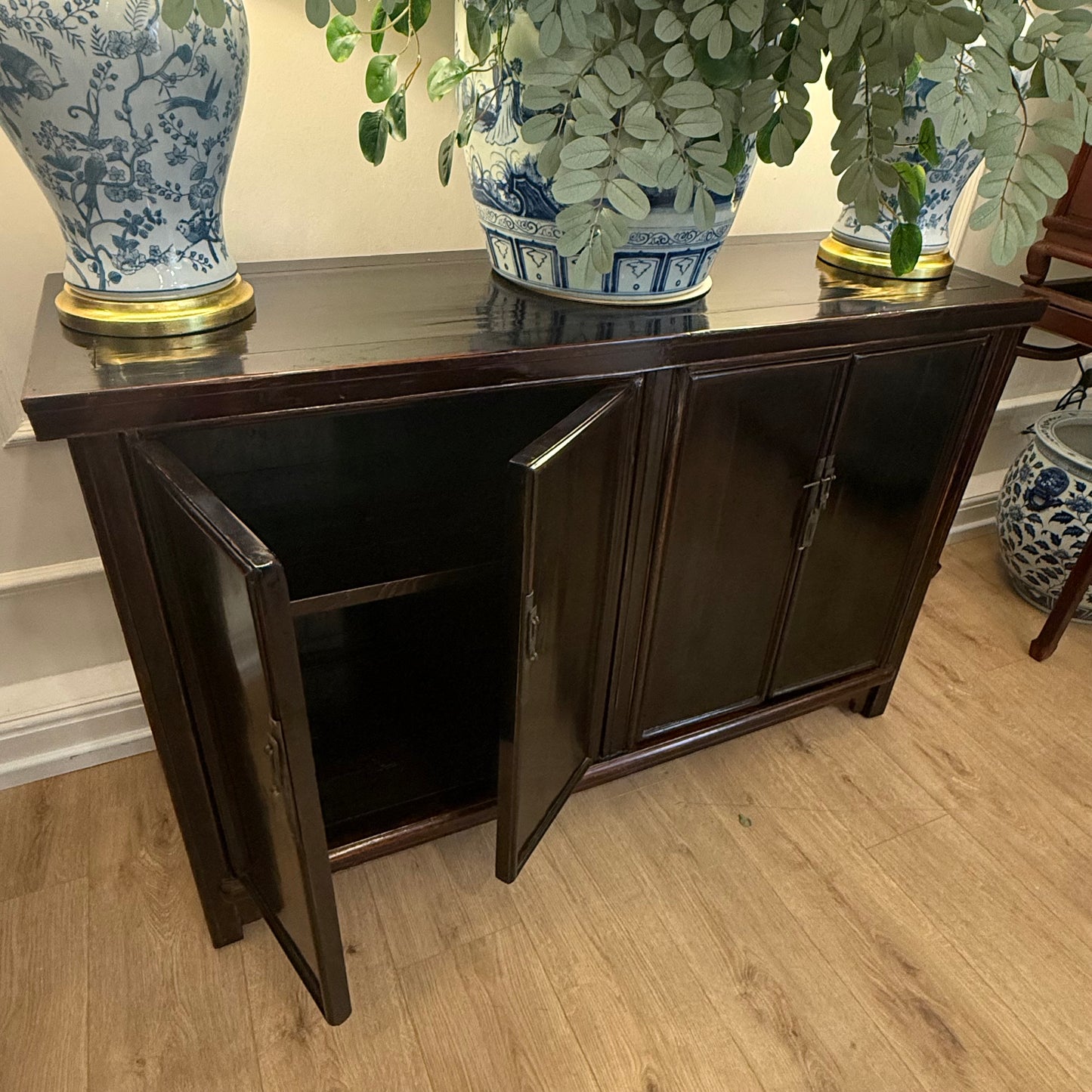 A striking Oriental Sideboard In Rich Black Lacquer