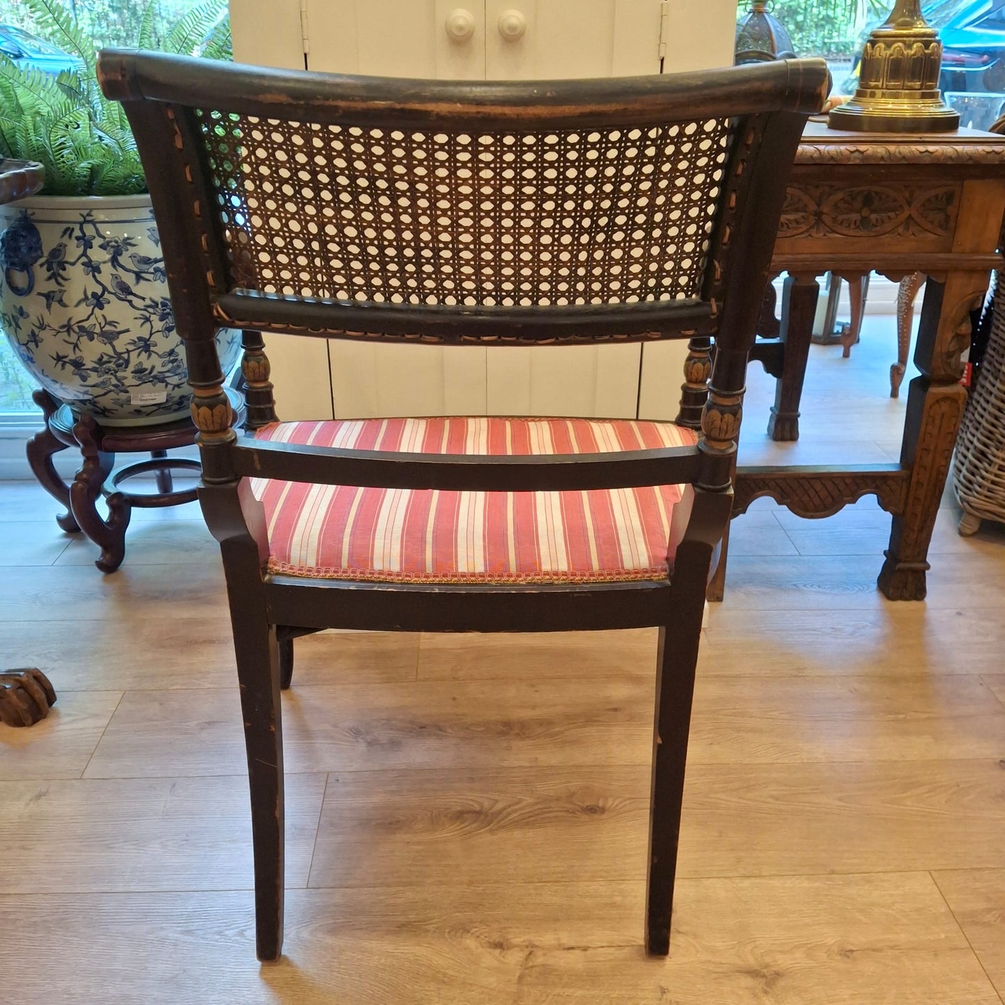 Regency‑Style Armchair with Cane Back and Striped Seat